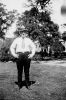Man standing on a lawn Man standing on a lawn