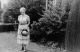 Woman Standing in a Yard Woman Standing in a Yard